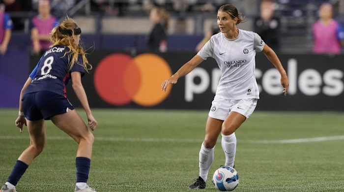 Orlando Pride defender Kylie Strom is defended by OL Reign forward Bethany Balcer in the second half at Lumen Field.